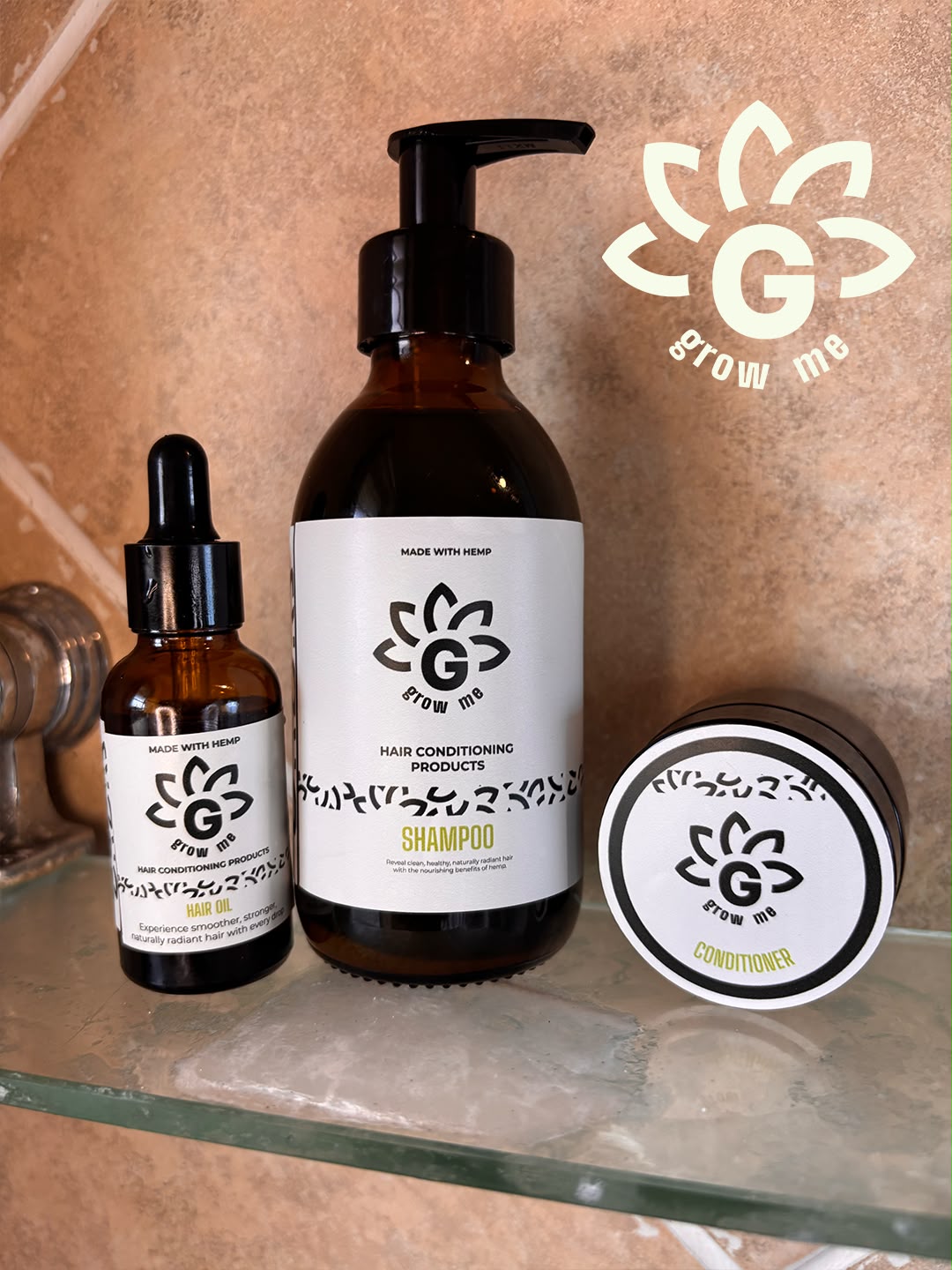 Grow Me hemp shampoo, conditioner and hair oil on a bathroom shelf